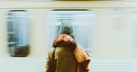 Girl in front of moving  train